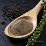 Firefly_A -spoon shot-—a wooden spoon lifting from a bowl of bright Black pepper Powder, show 480298