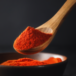 Firefly_A -spoon shot-—a wooden spoon lifting from a bowl of bright red chilli Powder, showin 480298