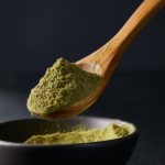 Firefly_A -spoon shot-—a wooden spoon lifting from a bowl of green Coriander Powder, showing 480298