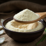 Firefly_Gemini Flash_A -spoon shot-—a wooden spoon lifting from a bowl of bright Onion Powder, showing the 393750