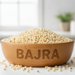 Firefly_Gemini Flash_A wooden bowl labelled as -Bajra- full of bright Pearl Millet (Bajra)______, the fine 646571