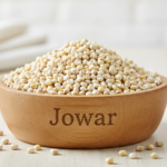 Firefly_Gemini Flash_A wooden bowl labelled as -Jowar- full of bright Sorghum (Jowar)_____, the fine grain 646571