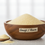 Firefly_Gemini Flash_A wooden bowl labelled as -Sooji - Rava- full of bright Refined Semolina (Sooji - Rav 646571